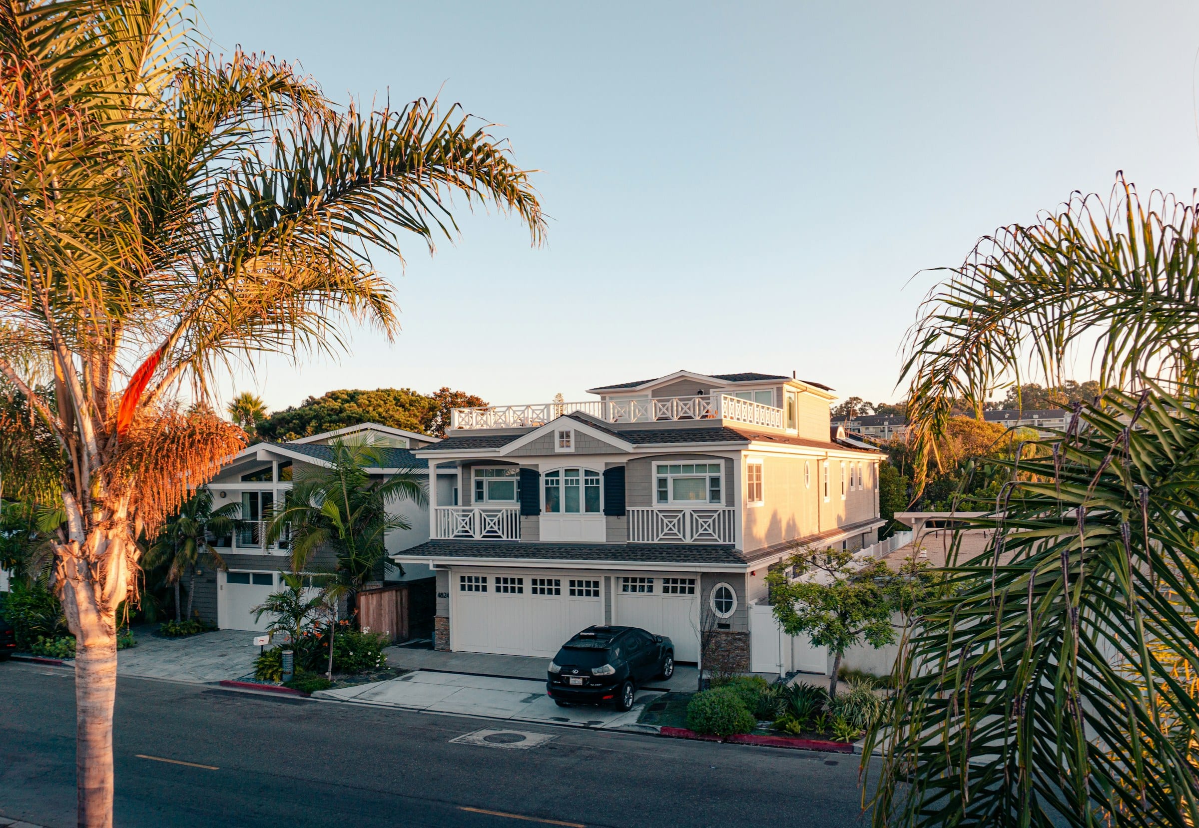Two story beach house in Newport Beach in warm evening light